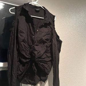 top features a deep V-neckline, ruching along the waist